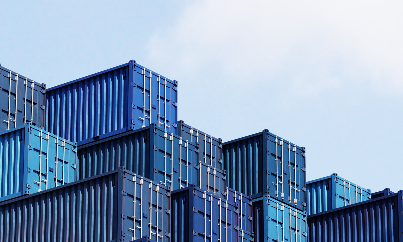 Stack of blue container boxes with sky background